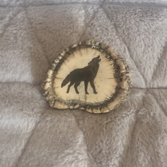 Belt buckle wolf could be an antler very cute